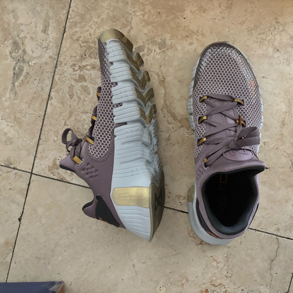Lately worn women’s size 11.5 Nike Metcon in a purple lavender with orange